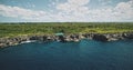 Green rock sea bay coast with turquoise lake on top aerial view. Nobody nature landscape of forests Royalty Free Stock Photo