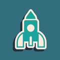 Green Rocket ship toy icon isolated on green background. Space travel. Long shadow style. Vector