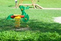 Green rocking chair in a green area for children iin italy Royalty Free Stock Photo