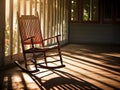 Chair rocking on a patio deck of house. Terrace with wooden rocking chair near green lawn on sunny day Royalty Free Stock Photo