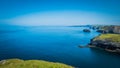 Rocky landscapes and cliffs at Tintagel castle in Cornwall, England with the Atlantic Ocean coastline Royalty Free Stock Photo