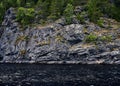 Green rocky sea shore. Background for travel and adventure materials