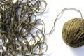 Tangled threads with a ball lie on a white background. Royalty Free Stock Photo