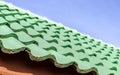 Green roof tile pattern over blue sky Royalty Free Stock Photo