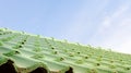 Green roof tile pattern over blue sky Royalty Free Stock Photo