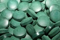 Green round healthy pills macro medical spirulina platensis space food modern high quality instant prints tablets background top