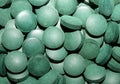 Green round healthy pills macro medical spirulina platensis space food modern high quality instant prints tablets background top