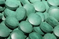 Green round healthy pills macro medical spirulina platensis space food modern high quality instant prints tablets background top