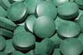 Green round healthy pills macro medical spirulina platensis space food modern high quality instant prints tablets background top