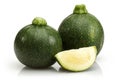 Green round zucchini and slice isolated on white Royalty Free Stock Photo