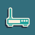 Green Router and wi-fi signal icon isolated on green background. Wireless ethernet modem router. Computer technology