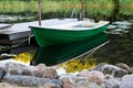 Green rowboat near dommy Royalty Free Stock Photo