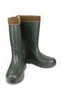 Green rubber boots with a warm toe on a white background Royalty Free Stock Photo