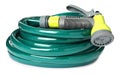 Green rubber watering hose with nozzle on white Royalty Free Stock Photo