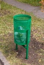 Green rubbish bin in nature Royalty Free Stock Photo