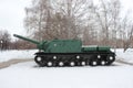 Green Russian battle tank on winter background