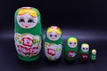 Green russian national Matrioska toy on dark background Royalty Free Stock Photo