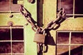 Green rusty metal gate closed with chain and padlock - concept image Royalty Free Stock Photo