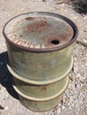 Green Rusty Old Oil Drum Barrel in Desert Royalty Free Stock Photo