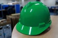 Green safety helmet complete with suspension and chin strap