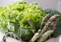 Green salad asparagus and broccoli in basket