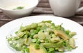 Green salad with avocado, arugula and snow peas Royalty Free Stock Photo