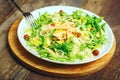 Green salad with avocado rucola nuts and couscous vegetarian healthy food Royalty Free Stock Photo