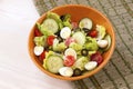 Green salad in bowl on table. Tomato, cucumber and salat Royalty Free Stock Photo