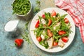 Green salad with chicken, strawberry and arugula. Royalty Free Stock Photo