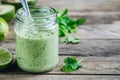 Green salad dressing with avocado, lime and cilantro in a glass jar Royalty Free Stock Photo