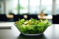 green salad served on a clean office cafeteria table