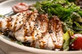 Green salad with smoked eel fish, avocado slices and chuka seaweed, close-up. Japanese cuisine concept. Royalty Free Stock Photo