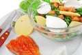 Green salad in transparent bowl