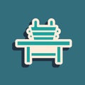 Green Sauna bench with bucket icon isolated on green background. Long shadow style. Vector