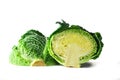Green savoy cabbage, a healthy winter vegetable, halved head isolated on a white background Royalty Free Stock Photo