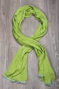 Green scarf on wooden background