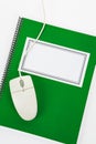 Green school textbook and computer mouse Royalty Free Stock Photo