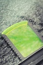 Scraper using to scrape ice from window in car, winter problems concept Royalty Free Stock Photo