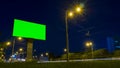 Green screen billboard on highway with traffic Royalty Free Stock Photo