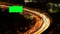 Green screen billboard with traffic jam on road at highway for advertising in urban city, Bangkok , Thailand at night Royalty Free Stock Photo