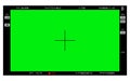 Green screen, chromakey background. Blank green background with VFX motion tracking markers. Screen of modern digital camcorders.