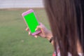 Green screen phone in the hands of the girl.