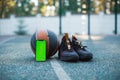 Green screen phone mock-up with tracking markers, basketball ball, sports shoes. Chroma key smartphone