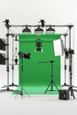 Green screen setup with multiple studio lights and a mounted camera Royalty Free Stock Photo