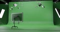 Green Screen Studio with Geometric Shapes and Lighting Equipment Royalty Free Stock Photo
