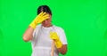 Green screen, tired cleaner and portrait of woman with gloves, fatigue and burnout from cleaning, work or washing on Royalty Free Stock Photo