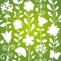 Green seamless pattern with flowers, butterflies and dragonflies. Royalty Free Stock Photo