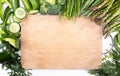 Green seasonal vegetables, top view. Frame, banner with a copy space. Spring veggies and wooden cutting board.