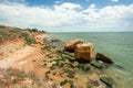 Green seaweed covered rocks over Black Sea and blue skies Royalty Free Stock Photo