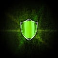 Green shield on the dark background Royalty Free Stock Photo